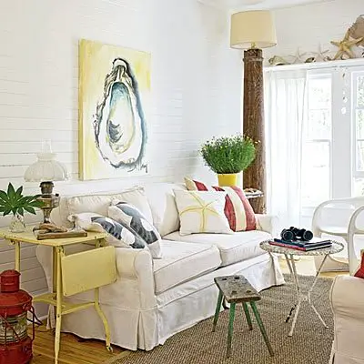 oyster painting above slip covered sofa