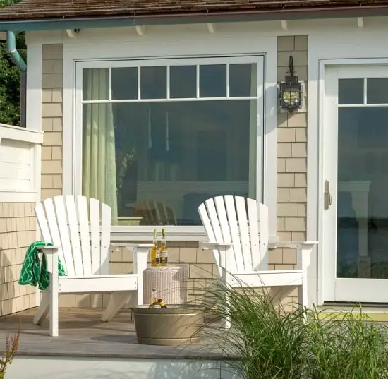 Beach Bungalow Patio with White Adirondack Chairs