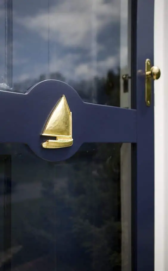 deep blue and gold boat on storm door